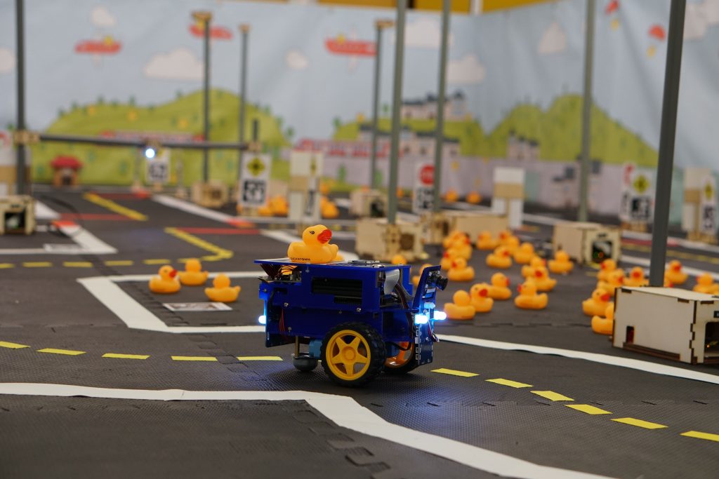 A DB21 Duckietown in a Duckietown equipped with Autolab infrastructure.